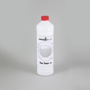 The picture shows the ceramic flow toner. The powdered toner is filled into a bottle and is suitable for use with lead-free toner sets.